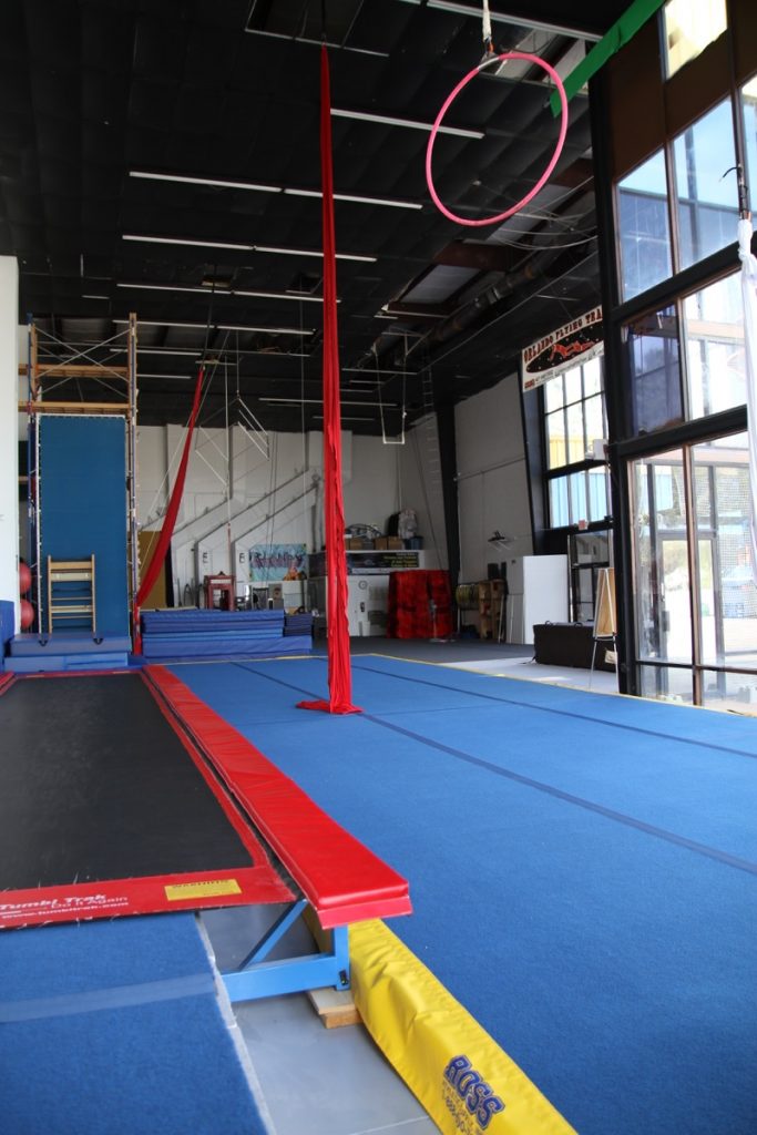 The Orlando Circus School studio with high ceilings, aerial silks, and a tumbling track, available to rent